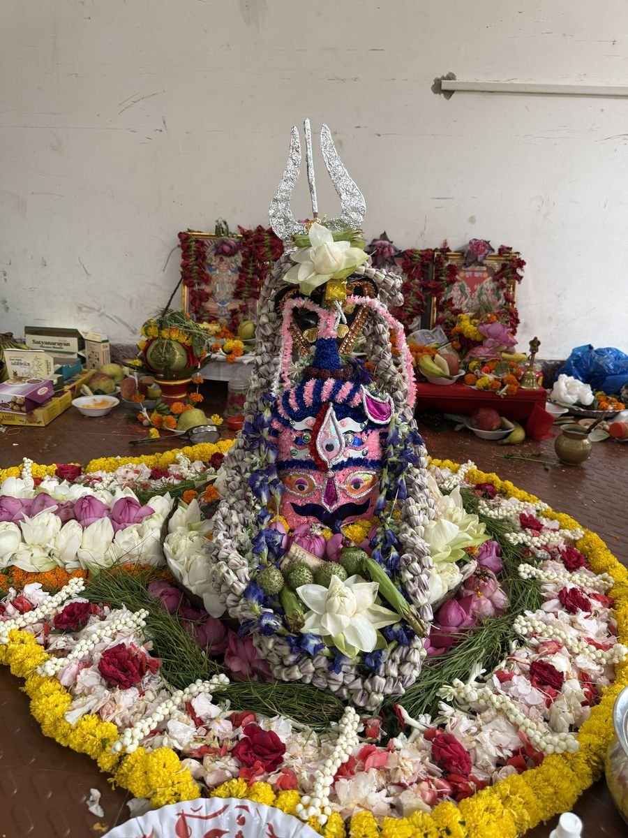 Shivling decorated with flowers for the office puja